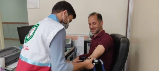 انجام تست فشار خون دانشجویان و کارکنان به مناسبت روز جهانی فشار خون بالا به همت سازمان جوانان جمعیت هلال احمر  6